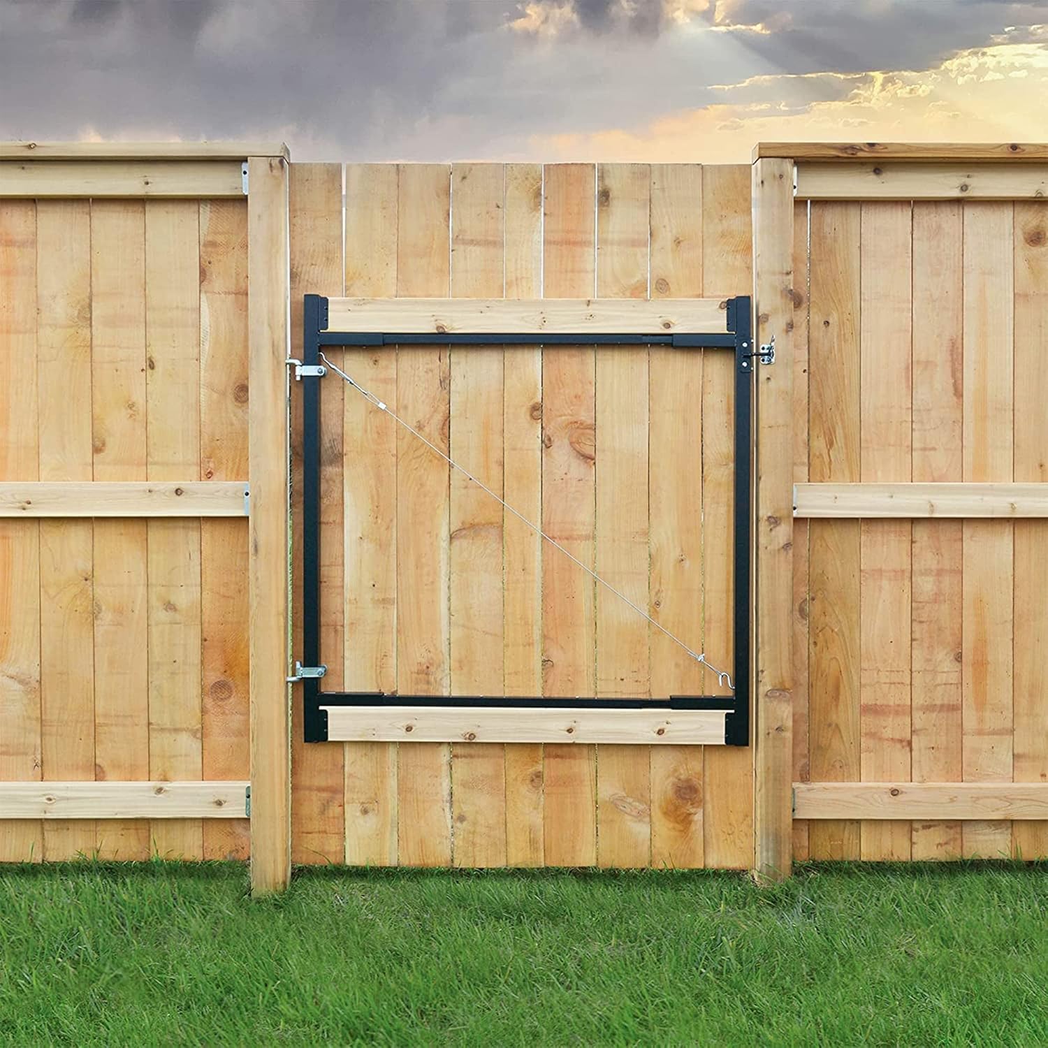 Adjust-A-Gate steel fence gate kit installed on wooden fence, designed for openings of 36" - 72".