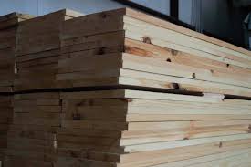 kiln dried ponderosa pine lumber stacked for woodworking and construction projects